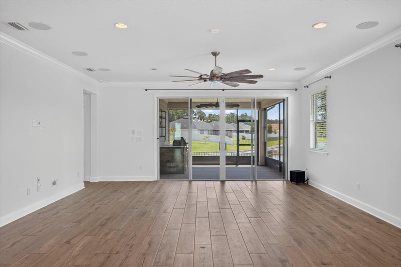 Living room with sliding glass doors and tile floor at 855 Flach Dr, St. Johns, FL