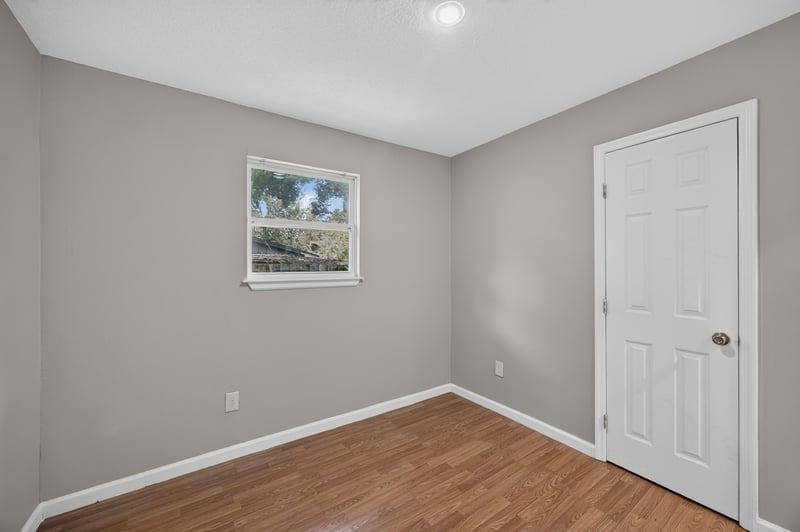 Empty room corner with window at 7015 Miss Muffet Ln N, Jacksonville, FL 32210