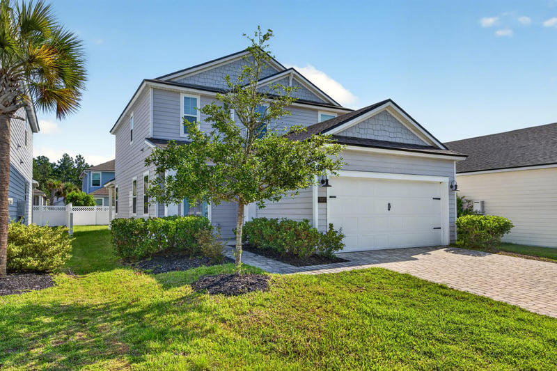 Front exterior with two-car garage at 331 Millerstone Dr, St. Augustine, FL 32092