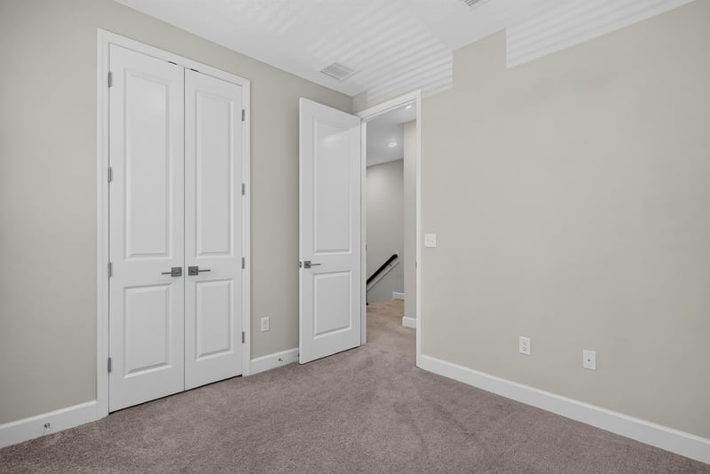 Bedroom with closet doors at 7446 Loggerhead Ct, Jacksonville, FL 32256