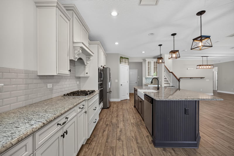 Kitchen counter with subway tile backsplash and granite counters at 53 Lumen Ct, St. Augustine, FL 32095