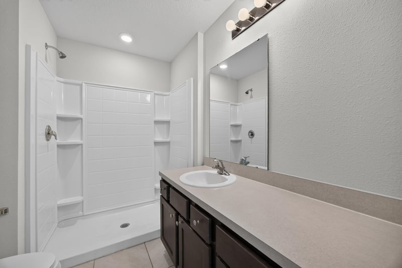 Bathroom with double-sink vanity and shower at 2837 Black Buck Cir, Jacksonville, FL 32225