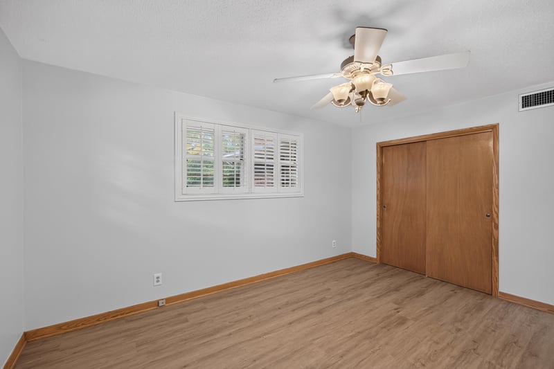 Empty bedroom with ceiling fan and closet doors at 1834 Memory Ln, Jacksonville, FL