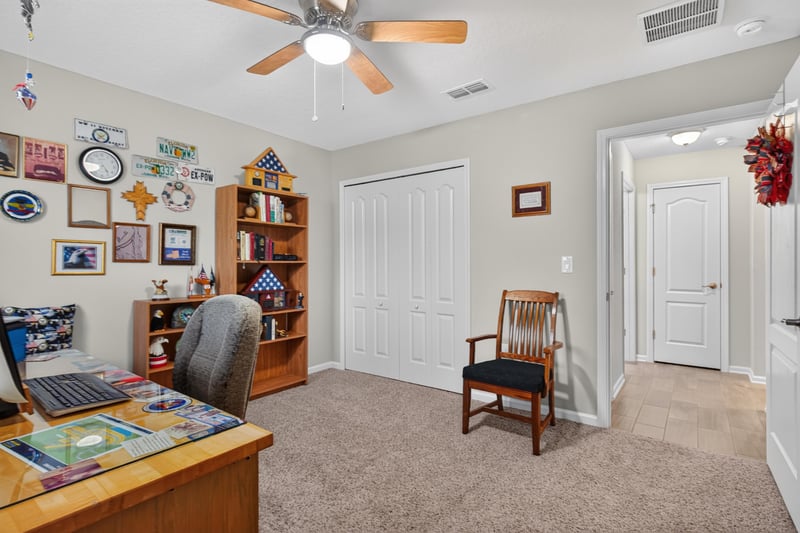Bonus room with bookshelves and wall art at 4319 Green River Pl, Middleburg, FL 32068