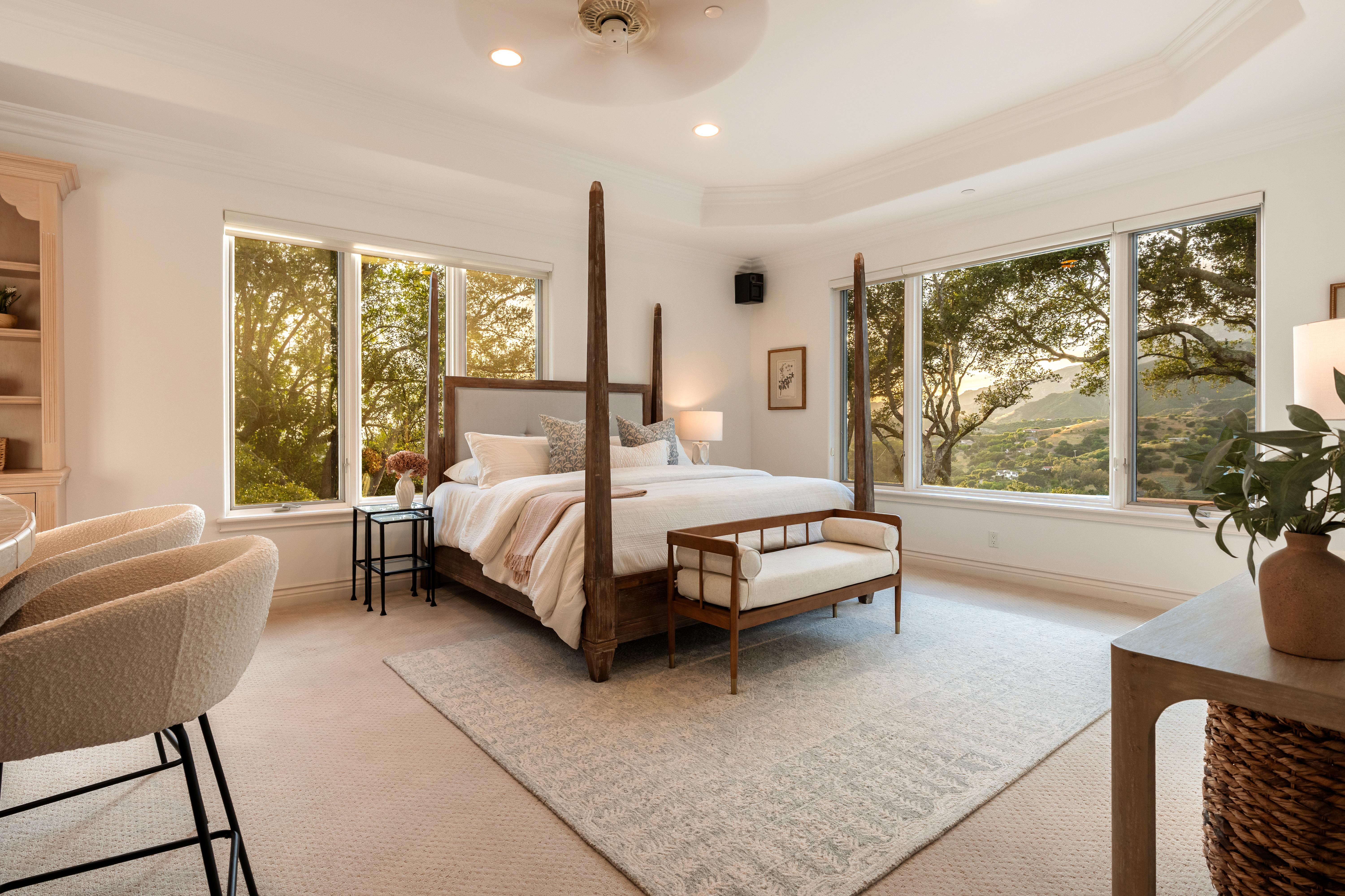 Aerial drone photography of hillside property grounds at 450 El Cielito Rd, Santa Barbara — real estate drone photography documenting terraced outdoor spaces, pool, and Santa Ynez Mountain backdrop along the Southern California coast. Our team captured still photography, aerial drone photography, twilight photography, a Matterport virtual tour, a 2D floor plan, and a custom property website from afternoon through twilight.