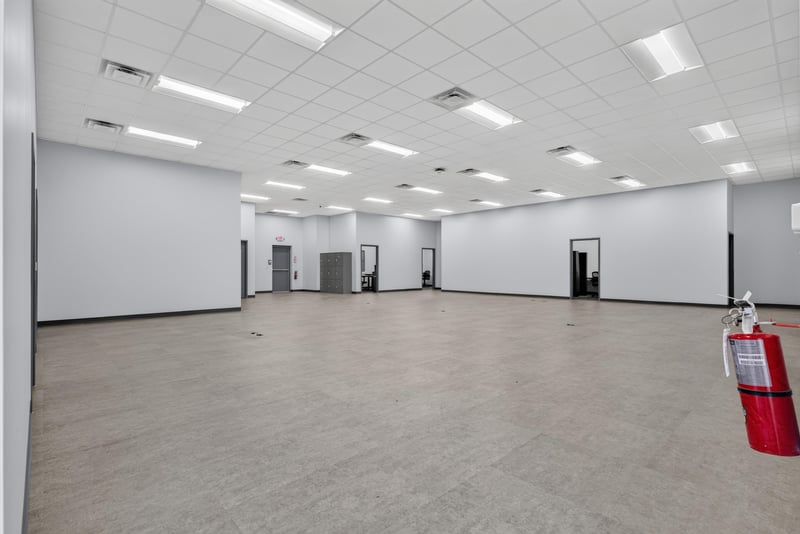 Empty open floor space with fire extinguisher station at 7240 Golden Wings Rd building 100, Jacksonville, FL 32244