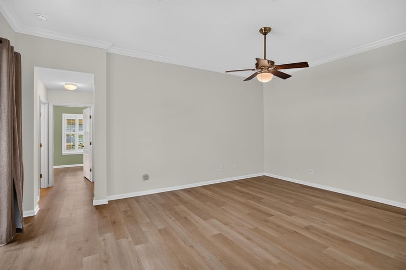 Hallway with wall niche and wood floors at 2131 E Stone Creek Dr, Fleming Island, FL