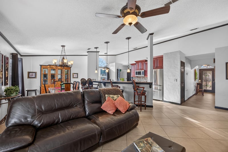 Open living room toward kitchen at 6931 Cane Grass Ln E, Jacksonville, FL 32244