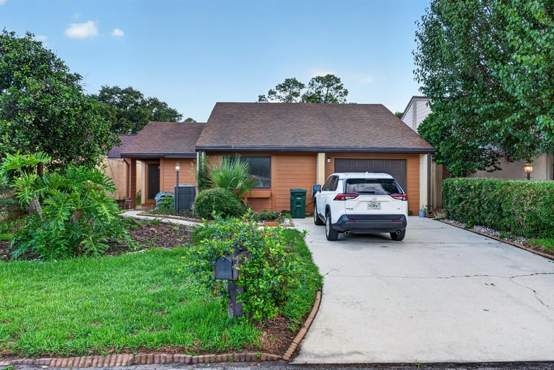 Front exterior with driveway and attached garage at 3515 Cormorant Branch Ct, Jacksonville, FL