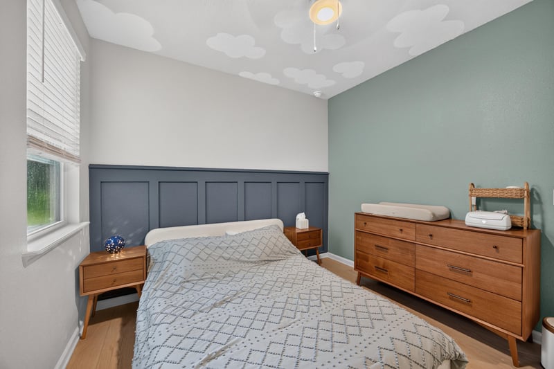 Secondary bedroom with bed and window at 93 Lochloosa Ct, St. Johns, FL 32259