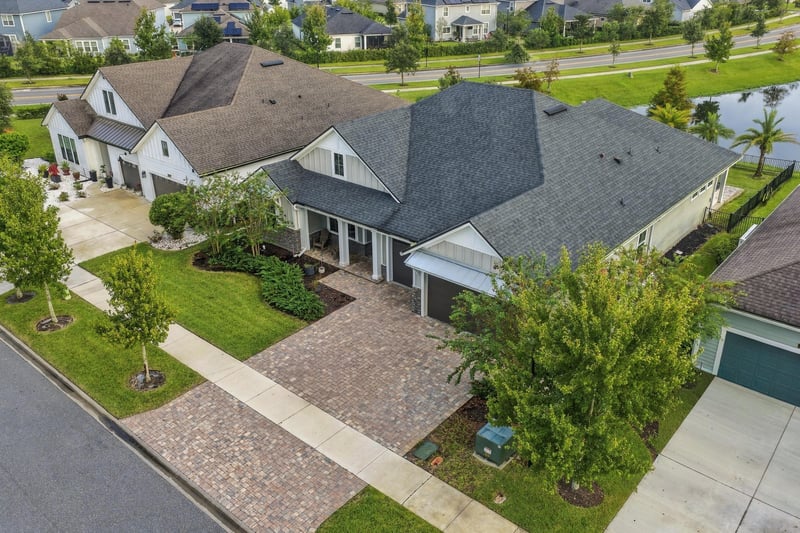 Aerial view of the front elevation and driveway at 3921 Spyglass Hill Ln