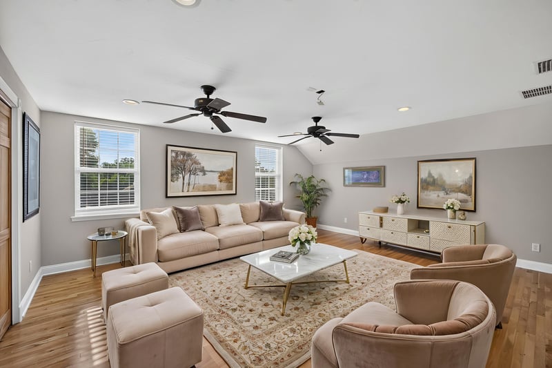 Living area staged with sofas and armchairs at 1735 Hagans Ridge Ct