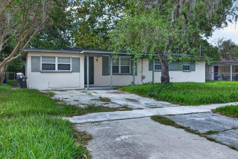 Front exterior under oak trees at 5812 Tampico Rd, Jacksonville, FL 32244