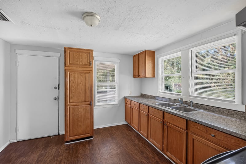 Kitchen entry with tall cabinet and window at 2372 2nd Ave, Jacksonville, FL 32208
