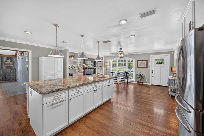 Kitchen opening into dining area at 5843 Ovella Rd, Jacksonville, FL 32244