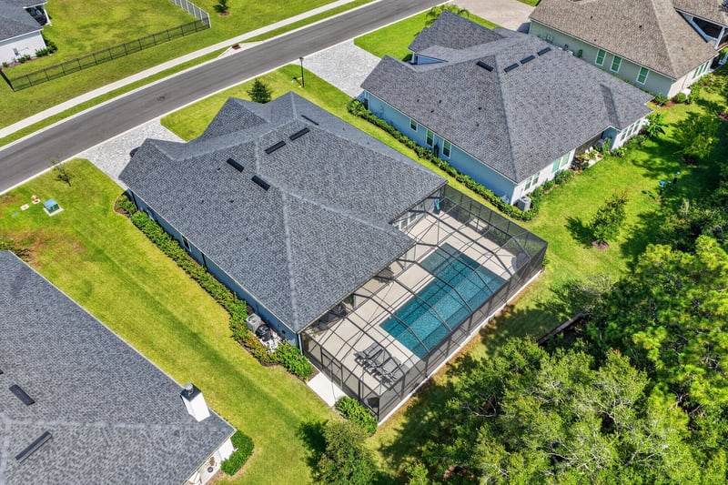 Aerial view of the home within the neighborhood in Whisper Creek