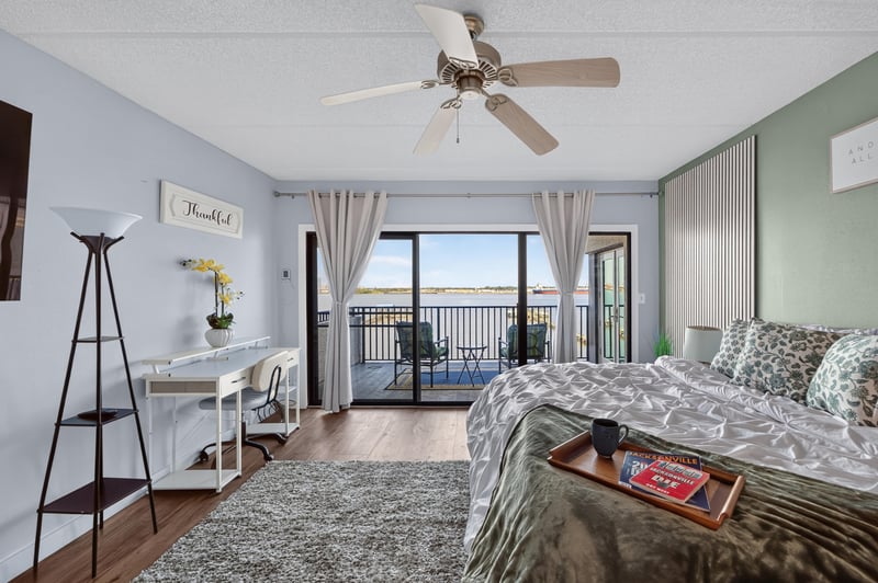Bedroom with green accent wall and ceiling fan at 2280 Shepard St