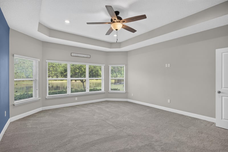 Bedroom with blue wall and tray ceiling at 53 Lumen Ct, St. Augustine, FL 32095