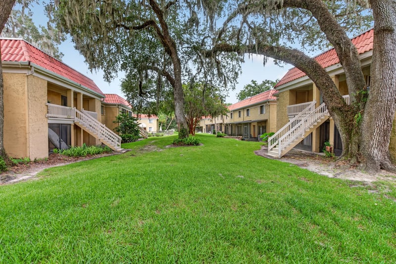 Grass courtyard between condo buildings at 5811 Atlantic Blvd unit 47, Jacksonville, FL 32207