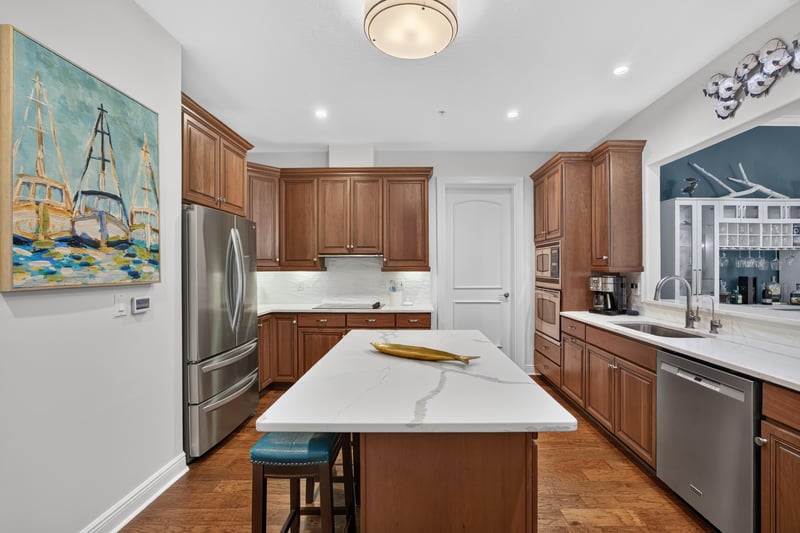 Kitchen with stainless refrigerator and center island at 140 Ave De La Mer, Palm Coast, FL 32137