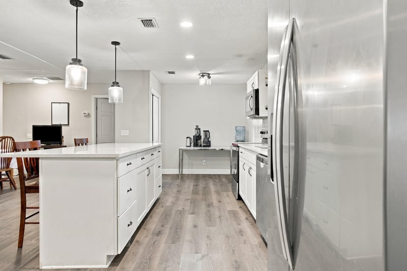 Kitchen with stainless refrigerator and white cabinets at 357 Dillon Dr, Orange Park, FL