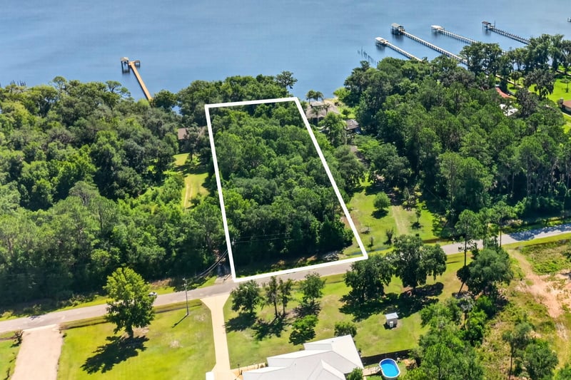 Aerial view of the tree-lined lot boundary near the road at 110 River Shores Rd, Palatka, FL 32043