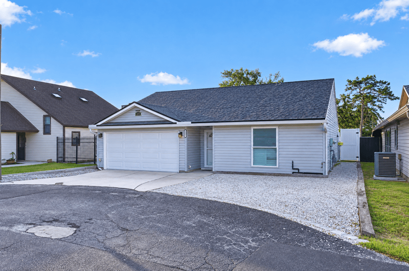 Front exterior view from the driveway, photographed by Megapixeler on Birch Run E, Orange Park