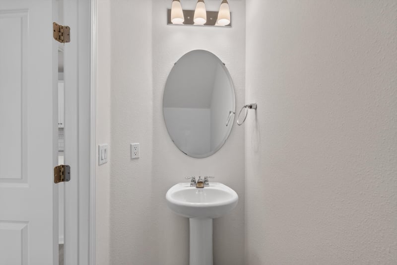 Half bath with pedestal sink at 39 Mellowood Ln, St. Augustine, FL 32092