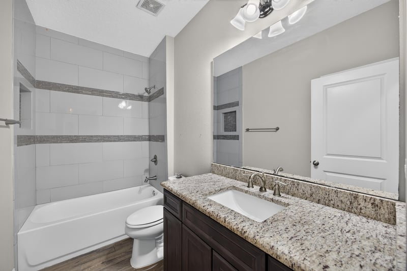 Bathroom with tub-shower combo and granite vanity at 53 Lumen Ct, St. Augustine, FL 32095