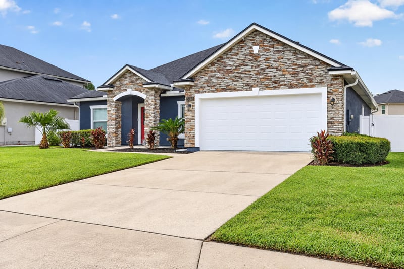 Front exterior with palm trees and walkway at 538 Porta Rosa Circle, St. Augustine, FL 32092