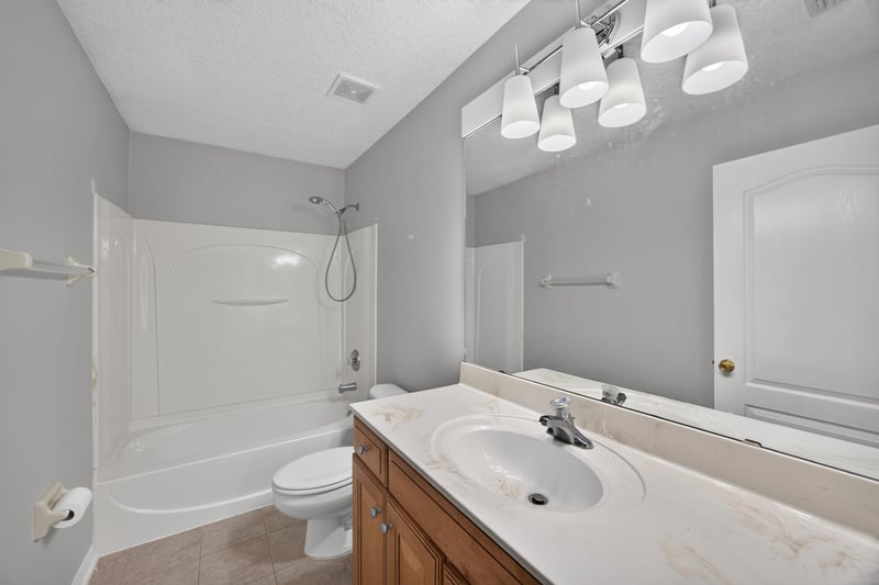 Bathroom with tub-shower combo and vanity at 635 Wakeview Dr, Orange Park, FL 32065
