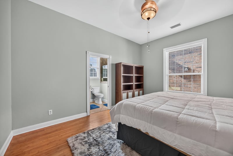 Bedroom with shelving unit and hardwood floors at 1735 Hagans Ridge Ct