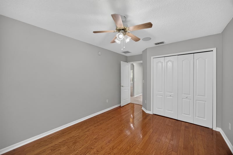 Bedroom with wood floor and ceiling fan at 635 Wakeview Dr, Orange Park, FL 32065