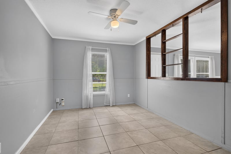 Living space with tile floor and ceiling fan at 2549 Snapdragon Ave, Middleburg, FL 32068