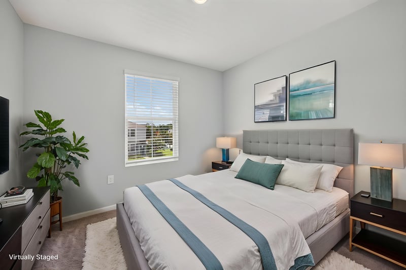 Bedroom virtually staged with bed and TV at 2837 Black Buck Cir, Jacksonville, FL 32225