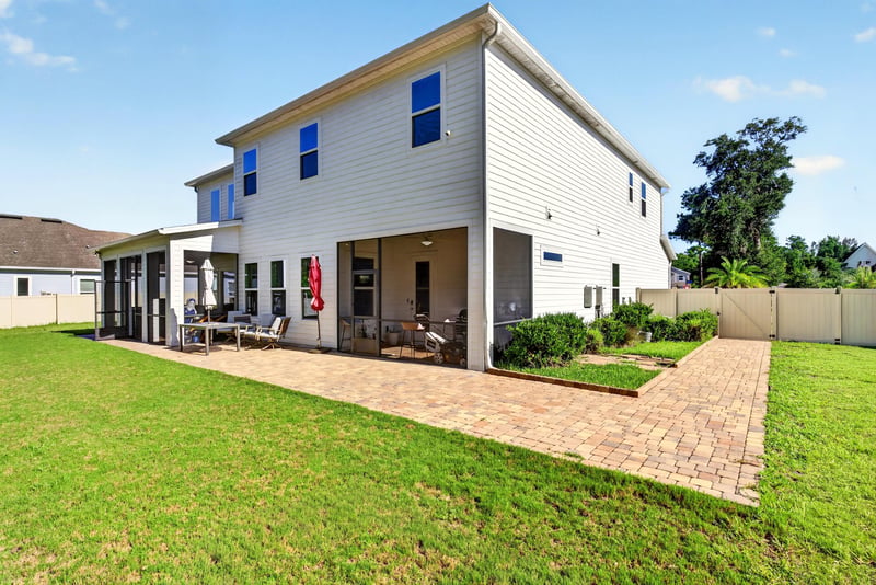 Backyard with paver patio and walkway at 22 Azura Point