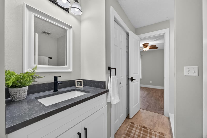 Bathroom vanity off hallway at 1161 Whispering Pines Rd, Jacksonville, FL 32259