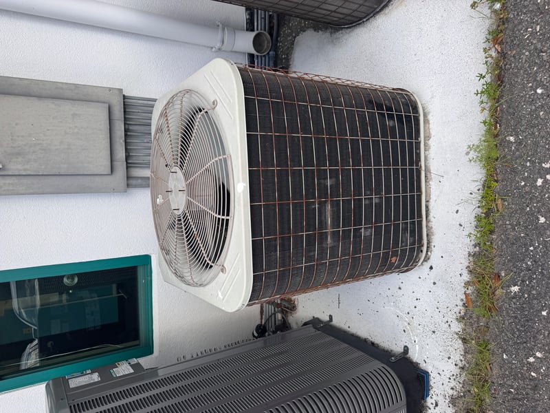 Condenser unit with round fan cage at 11700 New Kings Rd, Jacksonville, FL 32219