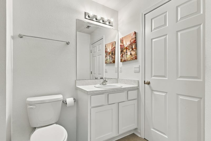 Bathroom vanity with mirror and towel bar at 8359 Zenith Cir, Jacksonville, FL 32256