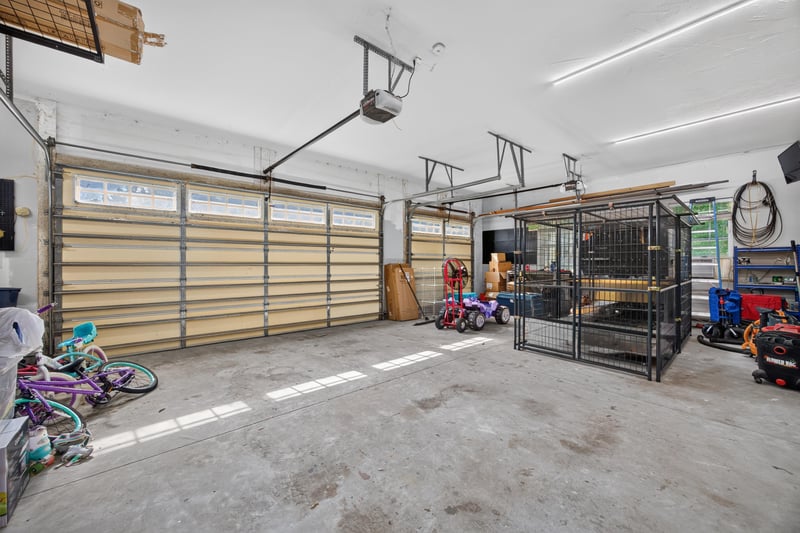 Garage interior with dog kennel at 1735 Hagans Ridge Ct