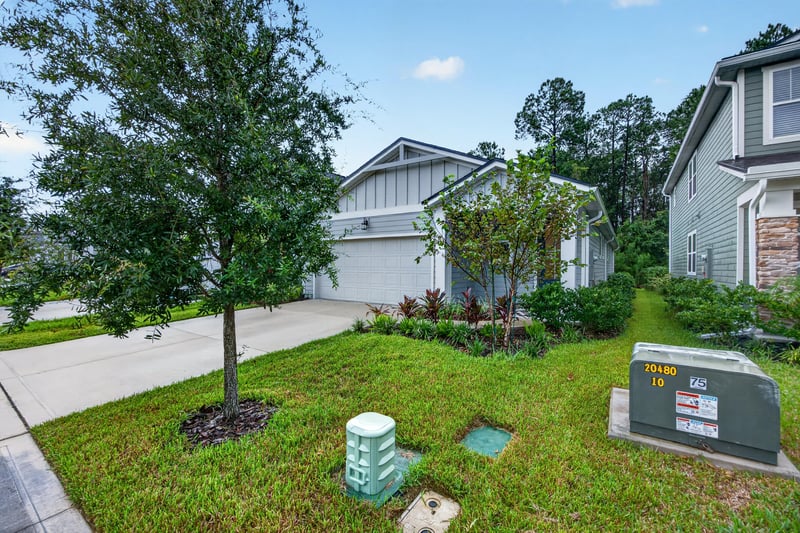 Street view with mailbox and neighboring homes at 93 Lochloosa Ct, St. Johns, FL 32259