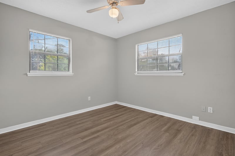 Kitchen sink area with gray cabinets and tile floor at 255 Woodside Dr, Orange Park, FL 32073