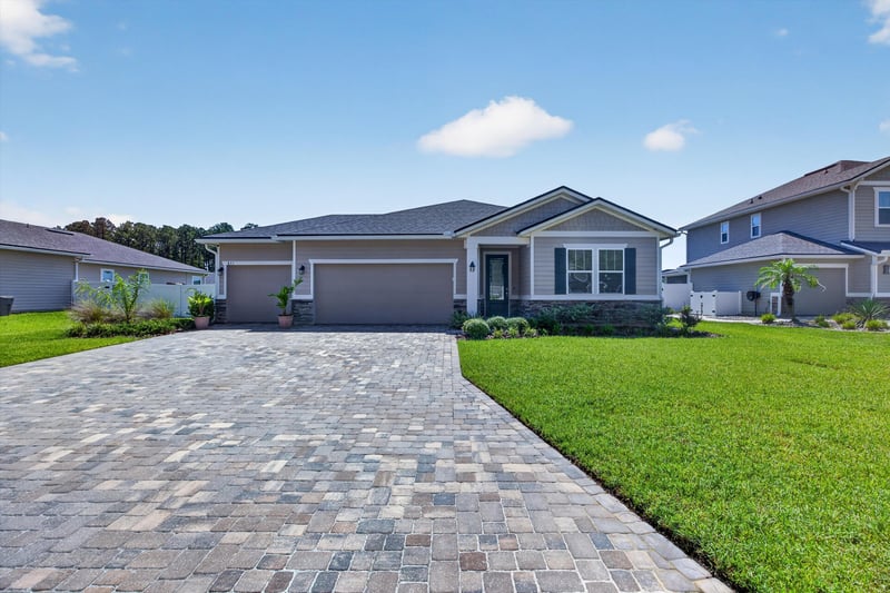 Front exterior with paver driveway at 855 Flach Dr, St. Johns, FL