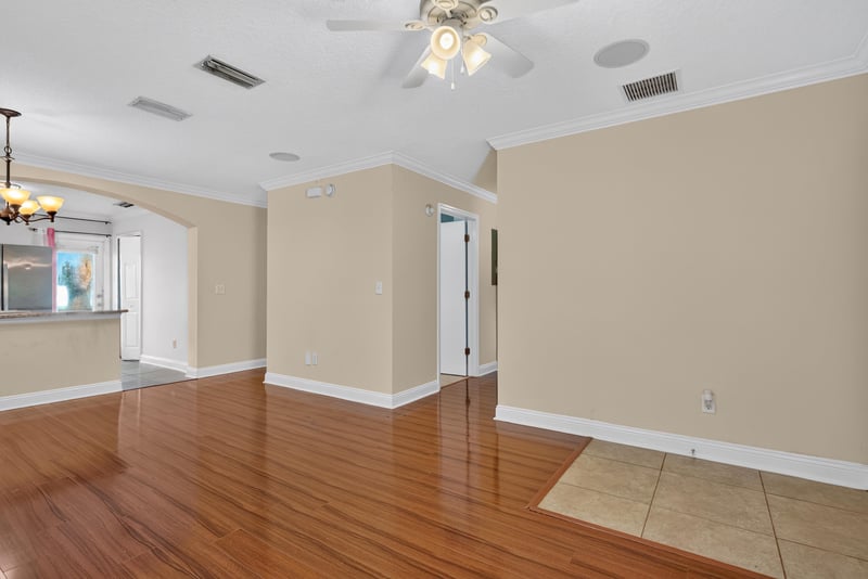 Empty room with hardwood floors and chandelier at 353 Redwood Ln