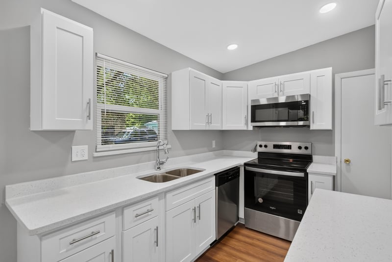 Kitchen with white countertops and stainless stove at 1928 Montmarte Dr, Jacksonville, FL 32210