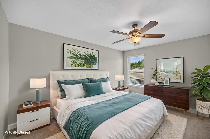 Primary bedroom with teal bedding, virtually staged, at 331 Millerstone Dr, St. Augustine, FL 32092
