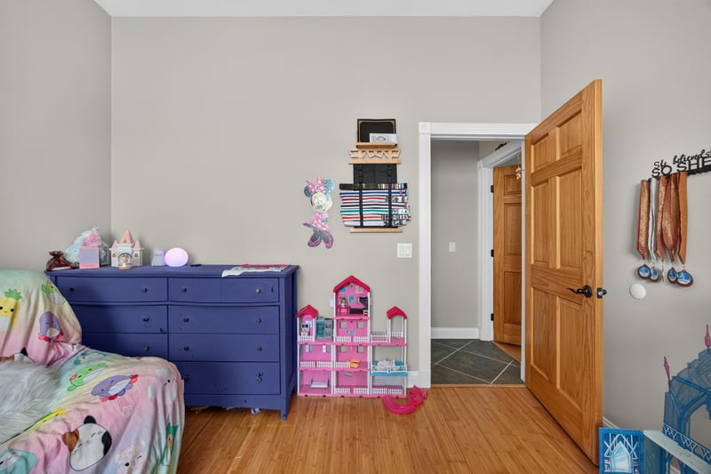 Bedroom with dresser and closet door at 1735 Hagans Ridge Ct