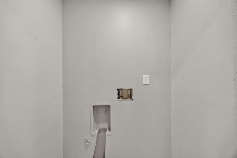 Unfinished utility area with electrical panel at 7015 Miss Muffet Ln N, Jacksonville, FL 32210