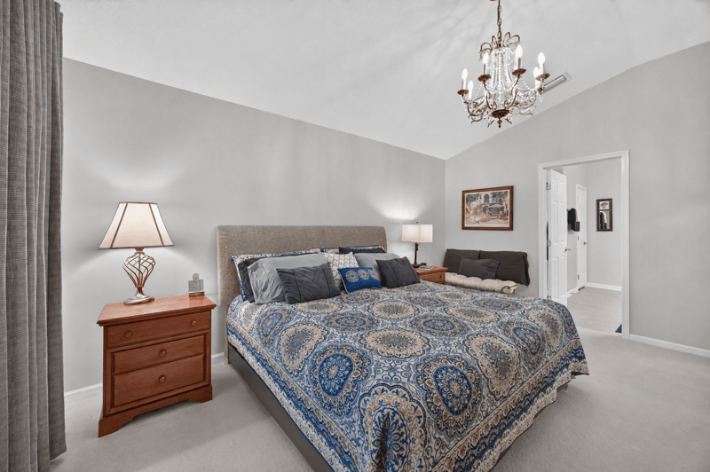 Primary bedroom with nightstand and lamp at 11225 Water Spring Cir, Jacksonville, FL 32256