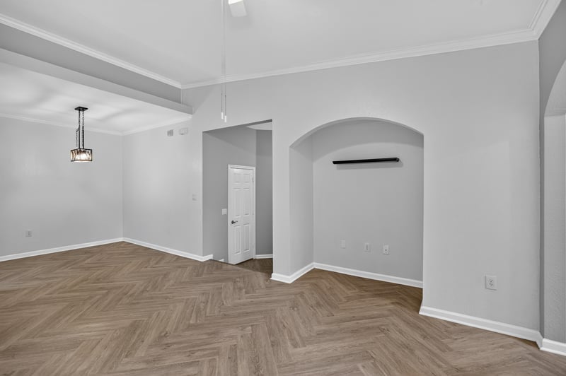 Hallway with arched doorway leading to additional rooms at 10075 Gate Pkwy unit 1905, Jacksonville, FL 32246